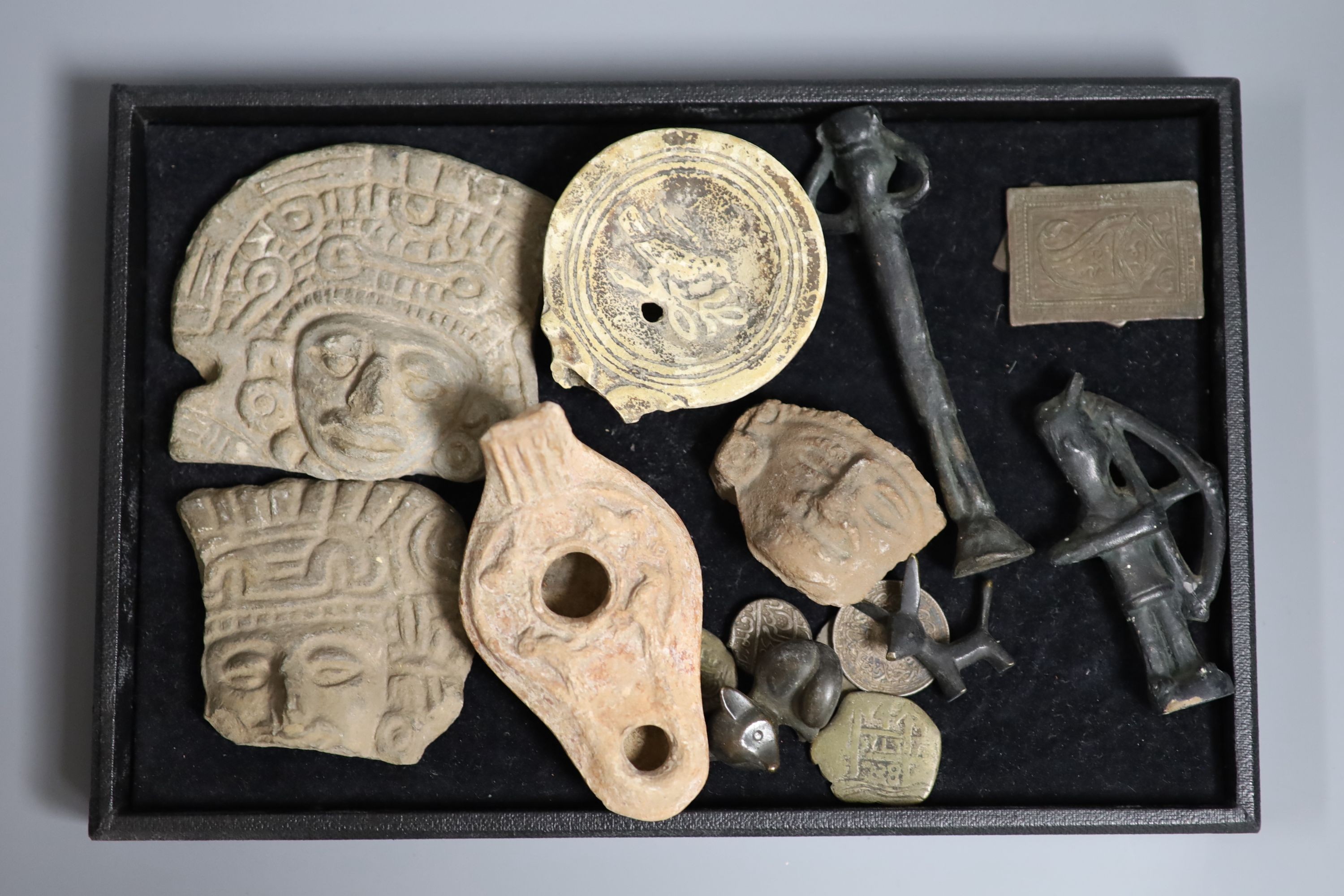 A group of curios including three pre-Columbian pottery fragments, Islamic coins and amulets, etc